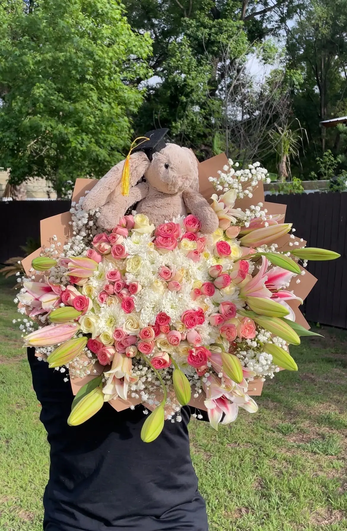 Large graduation bouquet with a plush bunny in a grad cap